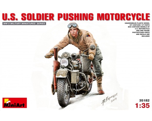 U.S.SOLDIER PUSHING MOTORCYCLE